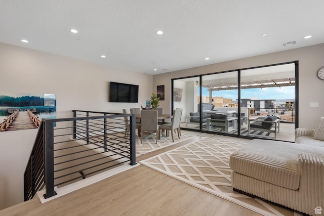 5401 S Aquamarine Ln E, St George, UT 84790 - living area featuring recessed lighting, wood finished floors, and visible vents