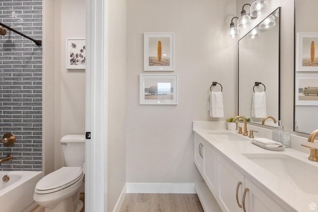 5401 S Aquamarine Ln E, St George, UT 84790 - full bath featuring wood finished floors, toilet, baseboards, and a sink