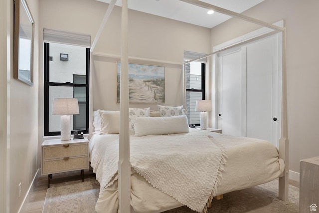 5401 S Aquamarine Ln E, St George, UT 84790 - bedroom with wood finished floors, baseboards, and a closet