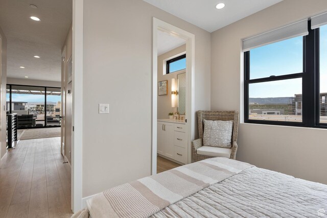 5401 S Aquamarine Ln E, St George, UT 84790 - bedroom featuring recessed lighting, light wood-style floors, and ensuite bath