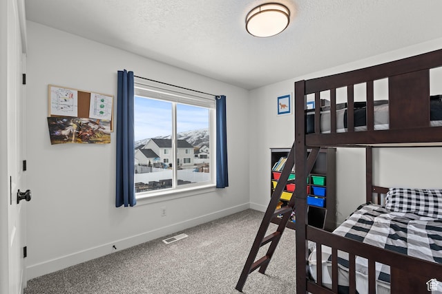 763 E 1200 S, Hyrum, UT 84319 - bedroom with baseboards, carpet floors, and a textured ceiling