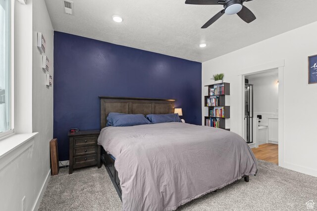 763 E 1200 S, Hyrum, UT 84319 - carpeted bedroom featuring baseboards, ensuite bath, and a ceiling fan