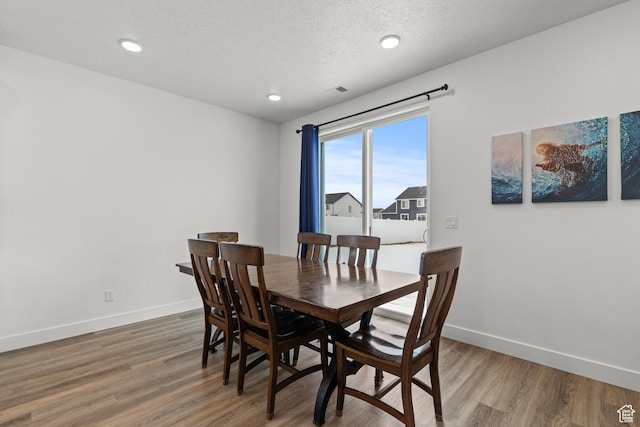 763 E 1200 S, Hyrum, UT 84319 - dining room with wood finished floors, baseboards, recessed lighting, and a textured ceiling