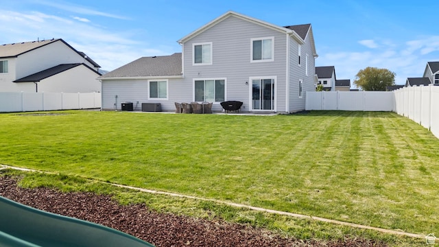 763 E 1200 S, Hyrum, UT 84319 - back of property featuring cooling unit, a patio, and roof with shingles