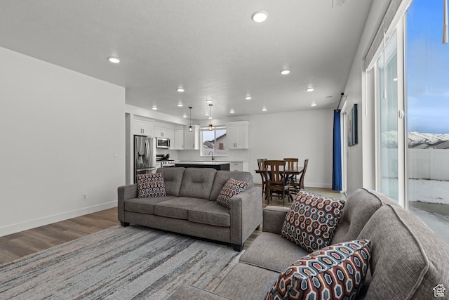 763 E 1200 S, Hyrum, UT 84319 - living area featuring light wood-style floors, recessed lighting, and baseboards