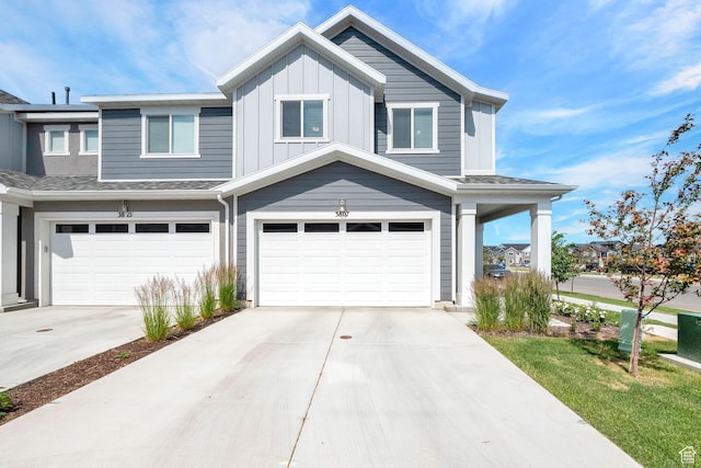 view of front of home featuring a garage, board and batten siding, and driveway