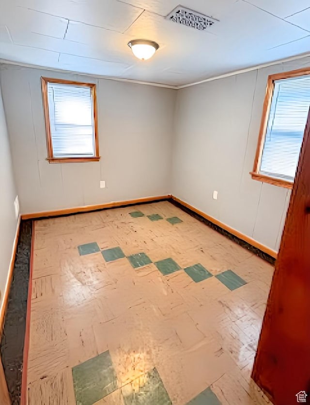 175 E 700 N, Logan, UT 84321 - spare room with tile patterned floors, baseboards, and a wealth of natural light