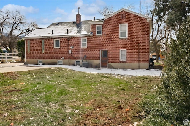 175 E 700 N, Logan, UT 84321 - back of house featuring brick siding, a lawn, a chimney, and fence