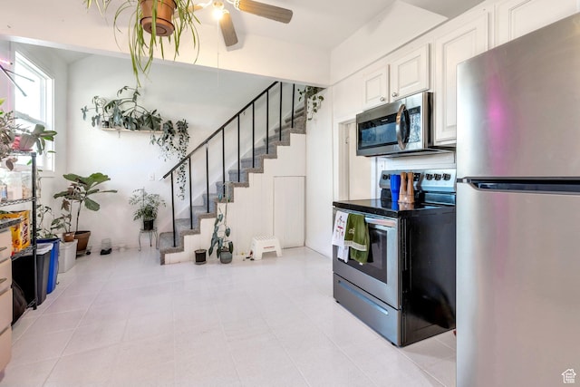 661 E 2735 S, Ogden, UT 84403 - kitchen with white cabinetry, ceiling fan, and stainless steel appliances