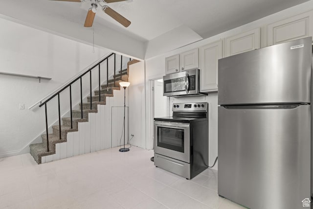 661 E 2735 S, Ogden, UT 84403 - kitchen with stainless steel appliances, ceiling fan, and light tile patterned floors