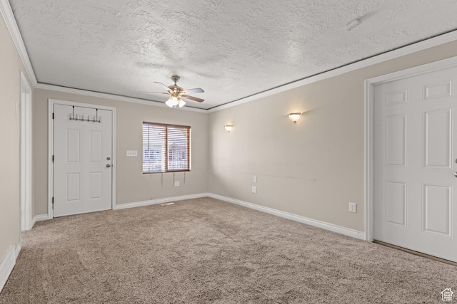 661 E 2735 S, Ogden, UT 84403 - carpeted spare room with ornamental molding, a textured ceiling, and a ceiling fan