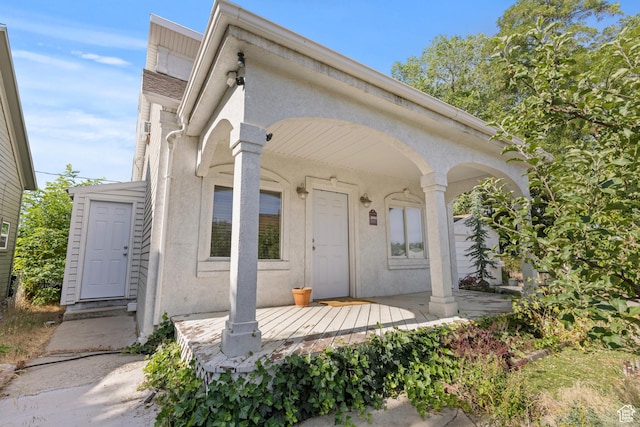 661 E 2735 S, Ogden, UT 84403 - view of front of house with stucco siding and a porch