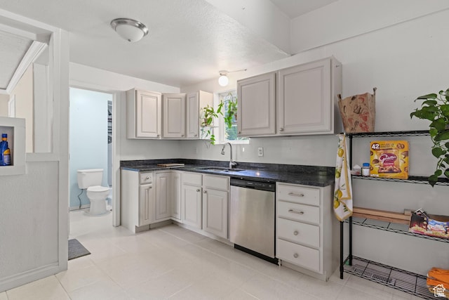 661 E 2735 S, Ogden, UT 84403 - kitchen with dishwasher, dark countertops, and light tile patterned flooring