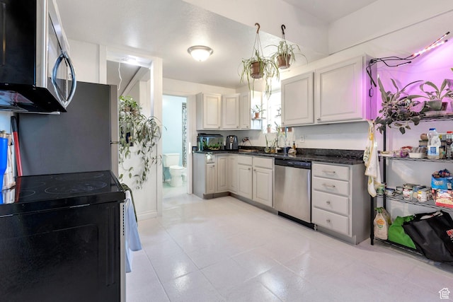 661 E 2735 S, Ogden, UT 84403 - kitchen with a sink, dark countertops, and stainless steel appliances