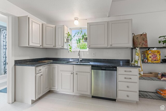 661 E 2735 S, Ogden, UT 84403 - kitchen featuring dishwasher, dark stone countertops, and light tile patterned floors