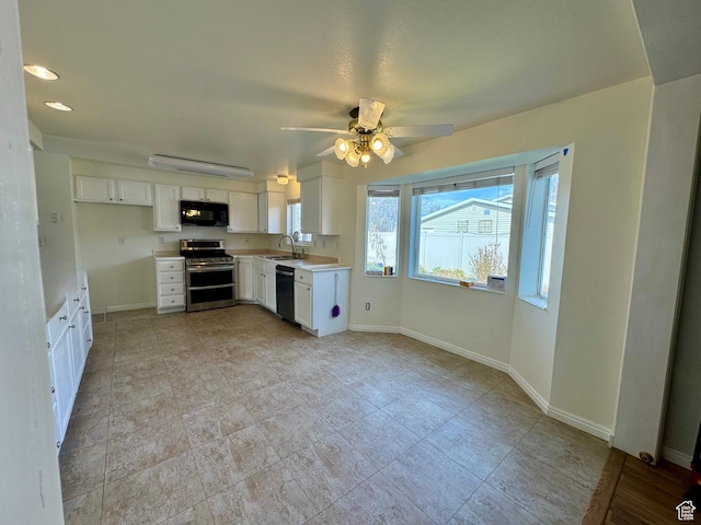 315 S 300 W, Santaquin, UT 84655 - kitchen with baseboards, white cabinets, a sink, and black appliances