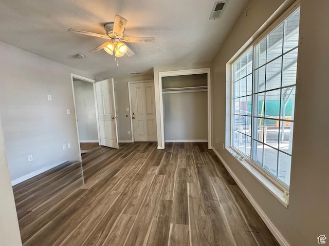 315 S 300 W, Santaquin, UT 84655 - unfurnished bedroom featuring two closets, baseboards, dark wood-style floors, and visible vents