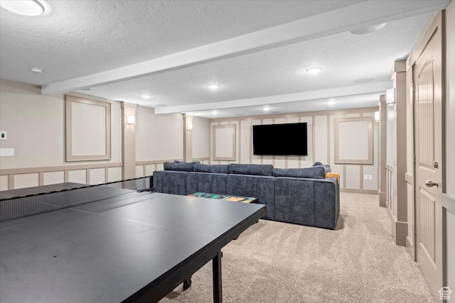 1336 S 2650 E, Springville, UT 84663 - rec room with beam ceiling, a textured ceiling, recessed lighting, a decorative wall, and light colored carpet