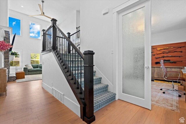 1336 S 2650 E, Springville, UT 84663 - staircase featuring a high ceiling, baseboards, wood-type flooring, and ceiling fan