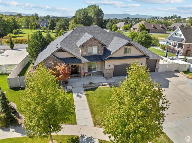 1336 S 2650 E, Springville, UT 84663 - view of front of home featuring stone siding, driveway, fence private yard, and a gate