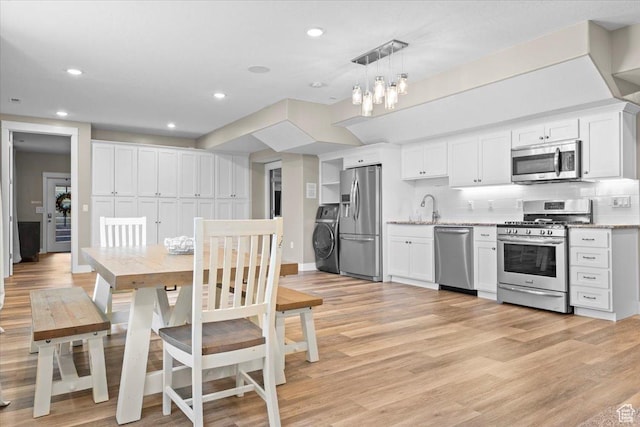 1336 S 2650 E, Springville, UT 84663 - dining area featuring light wood finished floors, recessed lighting, washer / clothes dryer, and baseboards