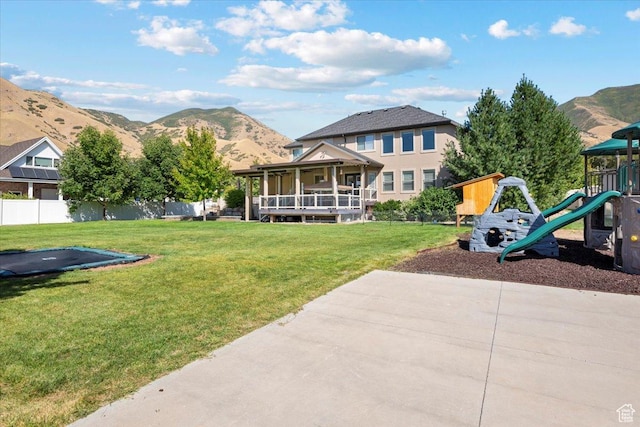 1336 S 2650 E, Springville, UT 84663 - rear view of house with a mountain view, playground community, a yard, and fence