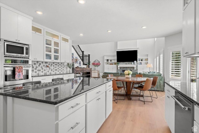 1336 S 2650 E, Springville, UT 84663 - kitchen with tasteful backsplash, a center island, stainless steel appliances, light wood-style floors, and white cabinetry