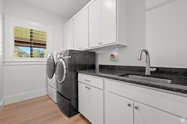 1336 S 2650 E, Springville, UT 84663 - laundry area with baseboards, light wood finished floors, cabinet space, separate washer and dryer, and a sink