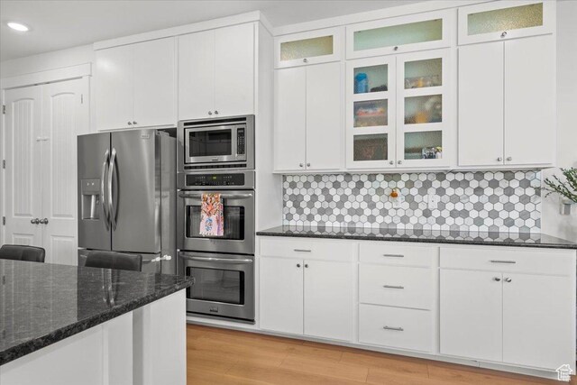 1336 S 2650 E, Springville, UT 84663 - kitchen with dark stone countertops, tasteful backsplash, appliances with stainless steel finishes, and white cabinets