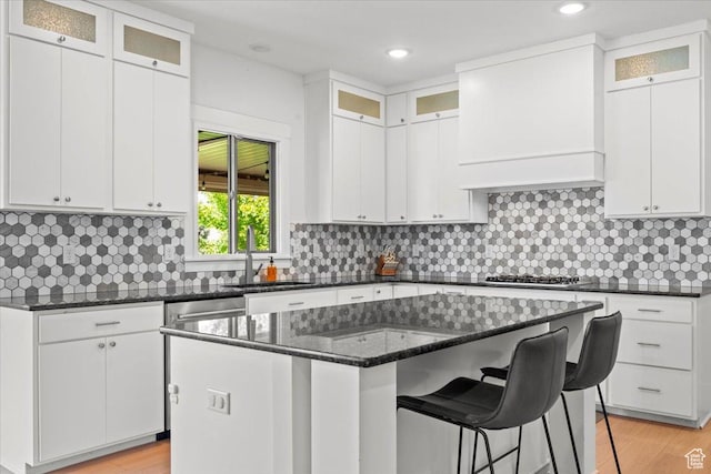 1336 S 2650 E, Springville, UT 84663 - kitchen featuring a sink, a kitchen island, stainless steel gas stovetop, and white cabinetry