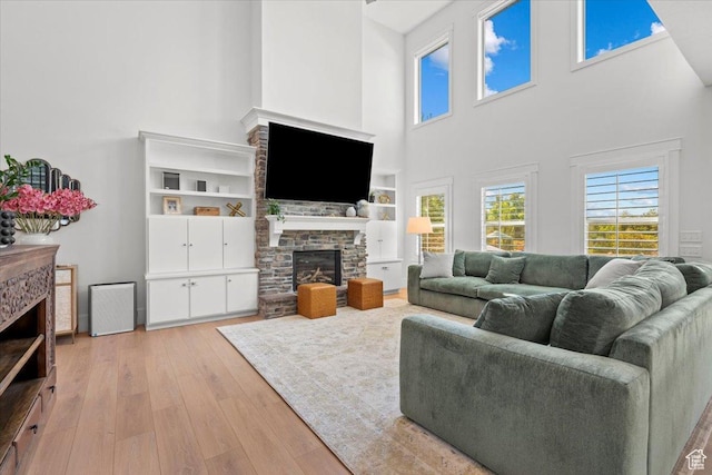 1336 S 2650 E, Springville, UT 84663 - living room with a fireplace and light wood-style floors