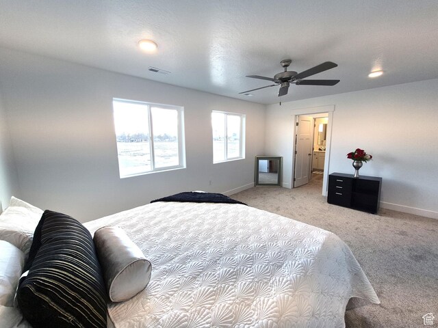 200 S 460 W Unit 4, Delta, UT 84624 - bedroom with visible vents, light colored carpet, a ceiling fan, and baseboards