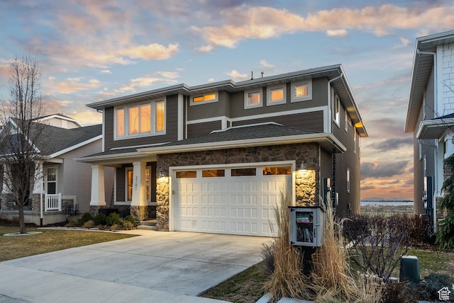 2101 W 980 S, Orem, UT 84059 - view of front of home with a garage, stone siding, and driveway