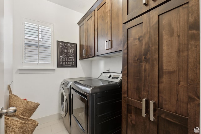 2101 W 980 S, Orem, UT 84059 - laundry room featuring washer and clothes dryer, cabinet space, baseboards, and light tile patterned flooring