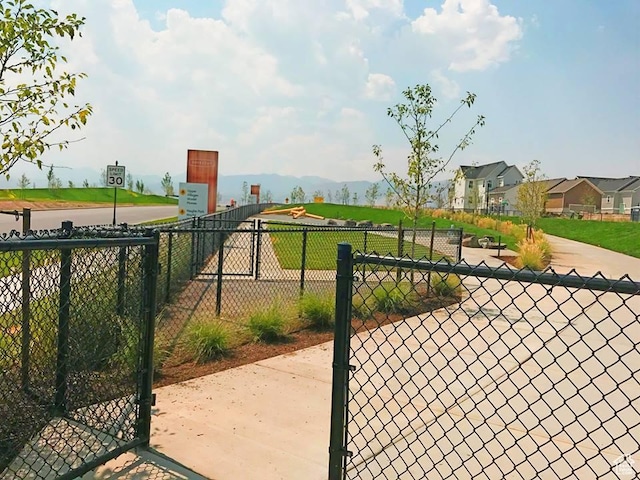 view of gate with fence
