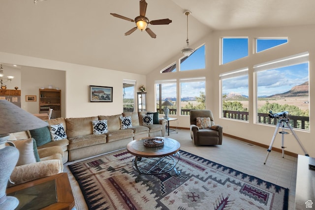 1617 N Mount Zion Dr, Apple Valley, UT 84737 - living area with high vaulted ceiling, ceiling fan with notable chandelier, baseboards, and visible vents