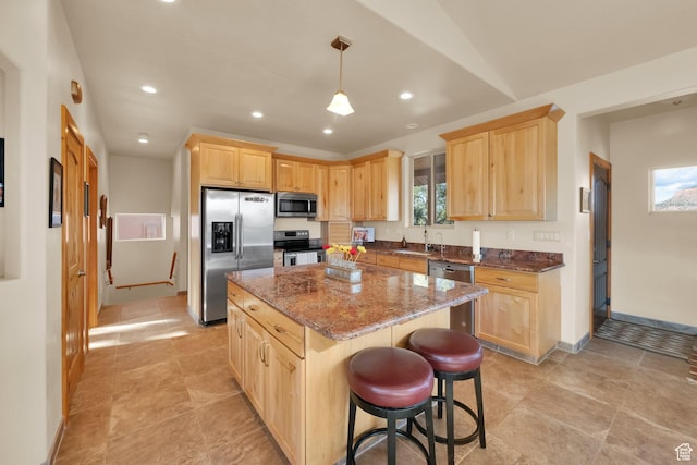 1617 N Mount Zion Dr, Apple Valley, UT 84737 - kitchen with appliances with stainless steel finishes, dark stone countertops, a sink, a center island, and light brown cabinetry