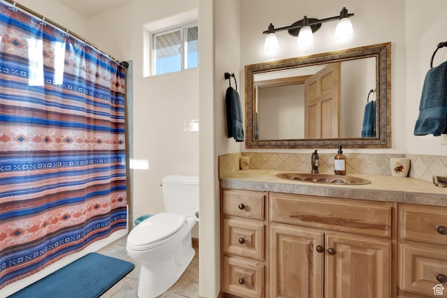 1617 N Mount Zion Dr, Apple Valley, UT 84737 - full bath featuring tile patterned floors, a shower with shower curtain, toilet, vanity, and backsplash