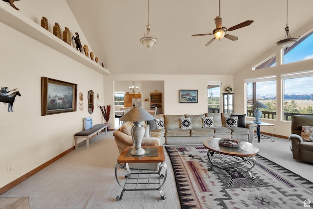 1617 N Mount Zion Dr, Apple Valley, UT 84737 - living room featuring baseboards, high vaulted ceiling, and ceiling fan with notable chandelier