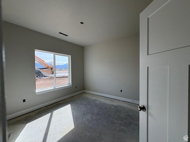 2861 N 3475 W Unit 15, Plain City, UT 84404 - empty room with unfinished concrete flooring and baseboards