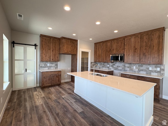 2861 N 3475 W Unit 15, Plain City, UT 84404 - kitchen featuring recessed lighting, dark wood finished floors, a sink, stainless steel microwave, and decorative backsplash
