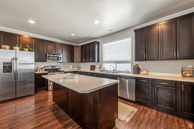 4712 W S Jordan Pkwy S, South Jordan, UT 84009 - kitchen featuring a sink, dark brown cabinetry, light countertops, appliances with stainless steel finishes, and dark wood-style flooring