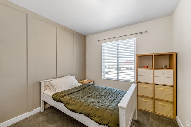 4712 W S Jordan Pkwy S, South Jordan, UT 84009 - bedroom featuring dark carpet and baseboards