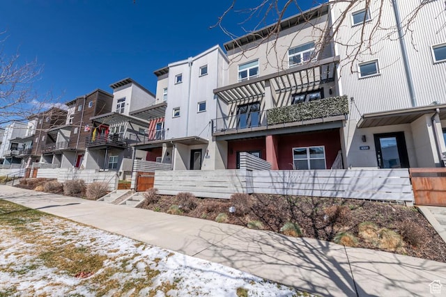 4712 W S Jordan Pkwy S, South Jordan, UT 84009 - view of building exterior with fence and a residential view
