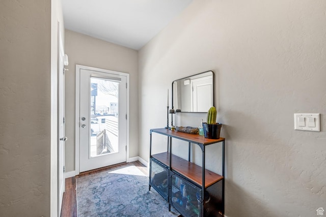 4712 W S Jordan Pkwy S, South Jordan, UT 84009 - doorway with wood finished floors, a textured wall, and baseboards