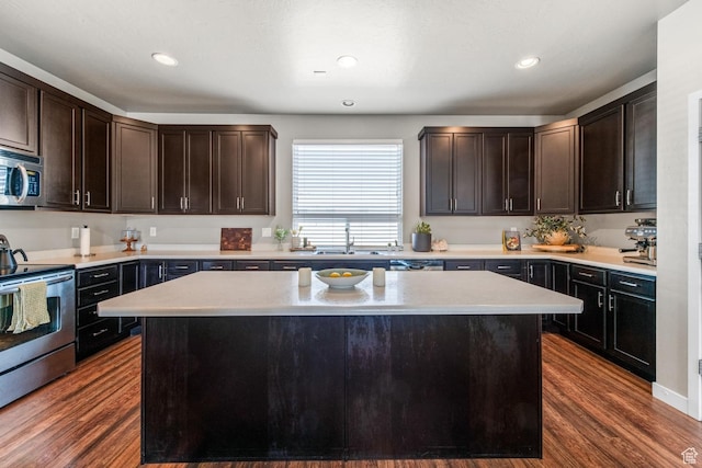 4712 W S Jordan Pkwy S, South Jordan, UT 84009 - kitchen with dark wood-style flooring, appliances with stainless steel finishes, light countertops, and a sink