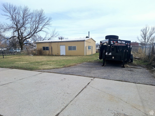 2801 W 1900 N, Plain City, UT 84404 - view of front facade with a front lawn, fence, and an outbuilding