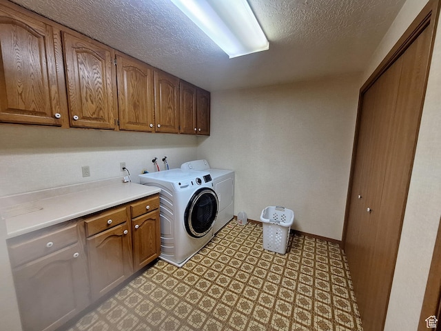 2801 W 1900 N, Plain City, UT 84404 - laundry room with cabinet space, light floors, washing machine and dryer, and a textured ceiling