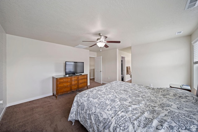 bedroom with baseboards, visible vents, and dark carpet
