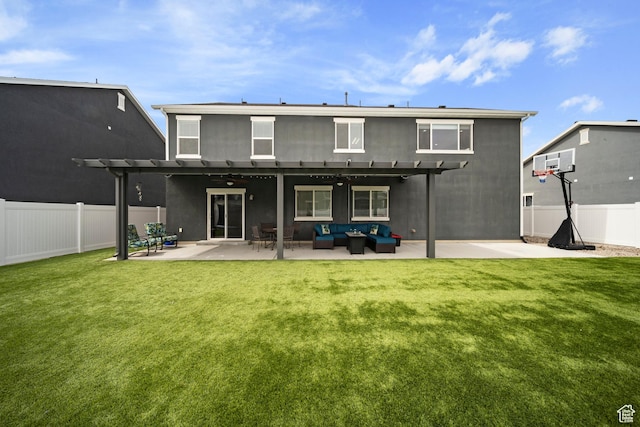 back of property with a lawn, an outdoor hangout area, a pergola, and a fenced backyard